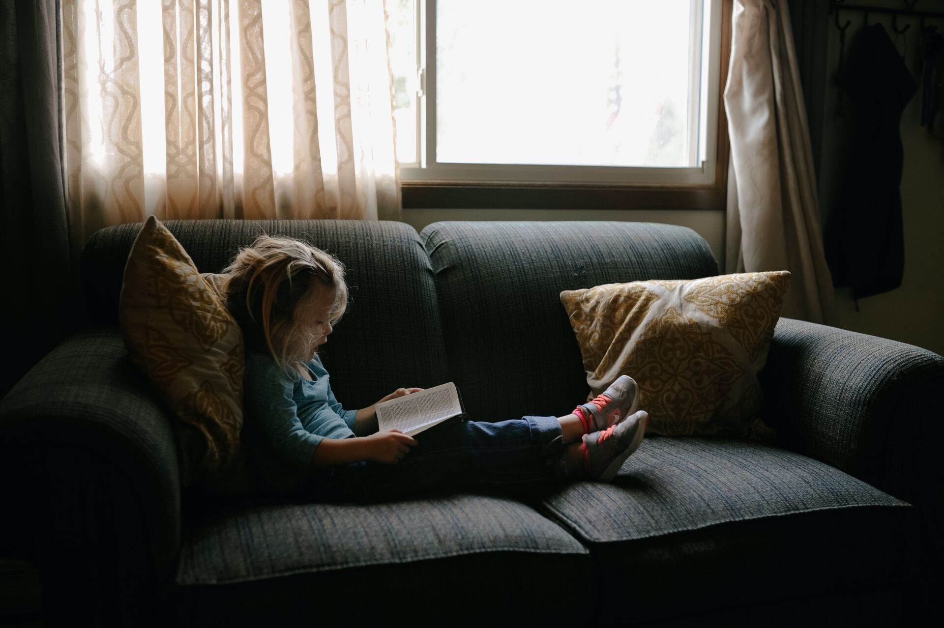 Child Reading Bible At Home